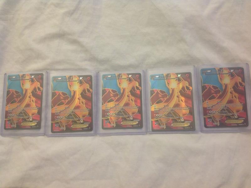 2 Full Art Charizards I pulled from Haxorus/Machamp 3 pack blisters, a third from a Charizard Tin, a fourth from a Charizard Ex Box and a 5th from a H