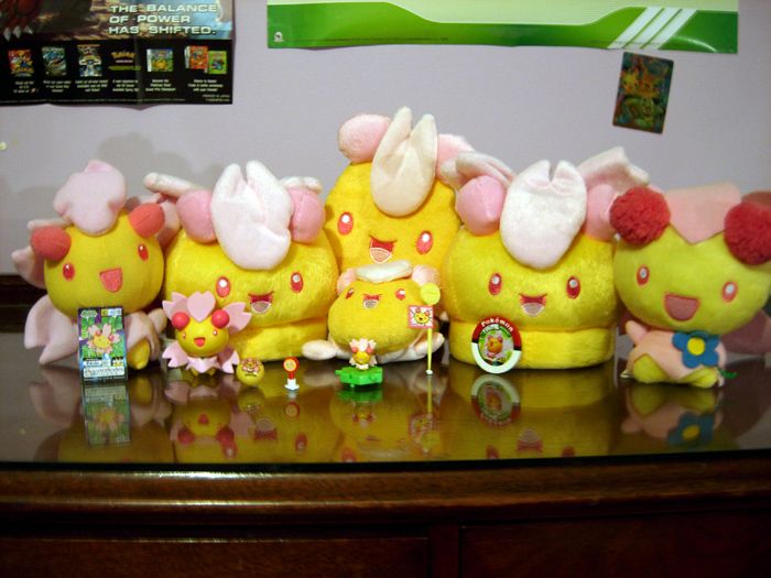 Agh, awful lighting. D: But this is my Cherrim collection in full. (Well, minus a sticker.)