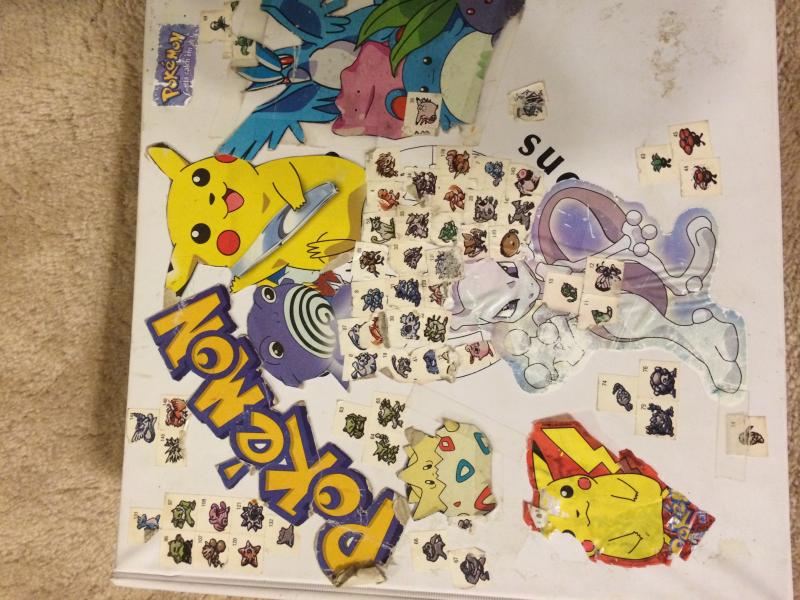 Front of my Pokemon Card Binder that I've had since I was 8. The small Pokemon stickers are from Red/Blue Strategy Guide while the rest of the Pokemon