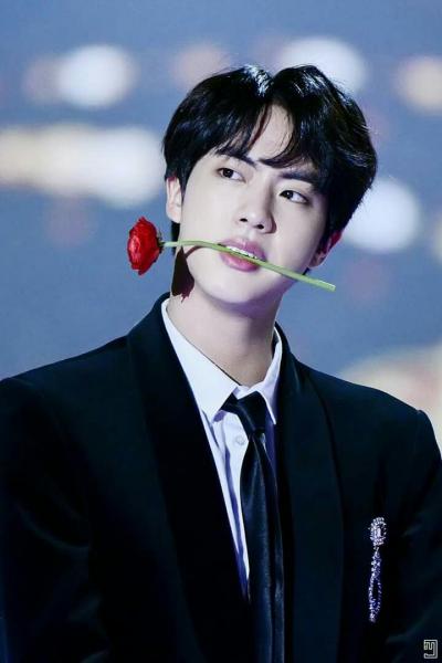 Jin with a rose in his mouth... can you think of anybody else who could pull it off?