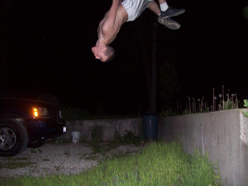 Me back flipping off of a concrete wall