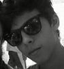 Me with my friend's sunglasses one year ago in a camp.