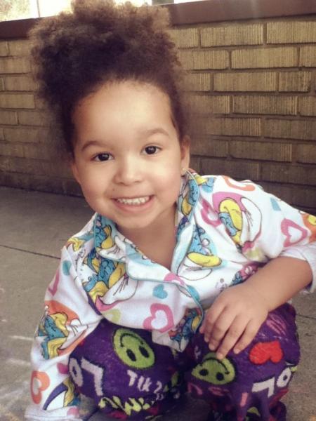 My little sister, T'aja, playing with chalk.
