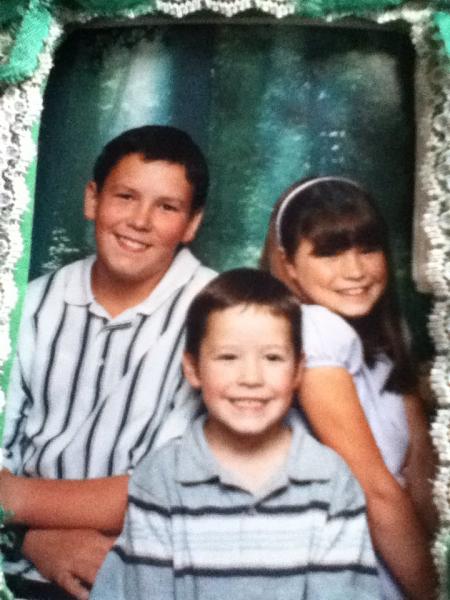 My older brother (left), me (middle), my older sister (right).