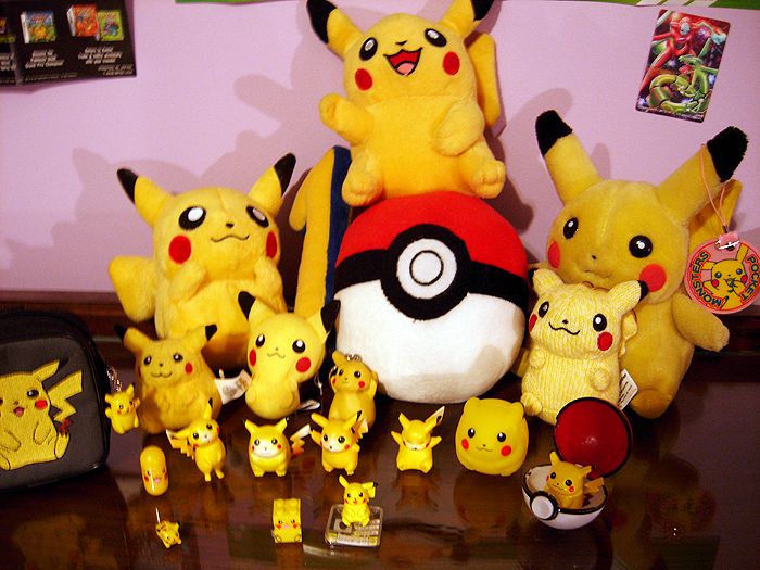My Pikachu stuff. :D I didn't take a single picture with the plushies, but the one in the far back is the CUTEST PIKACHU PLUSHIE EVER. EEVVERRR.

The 