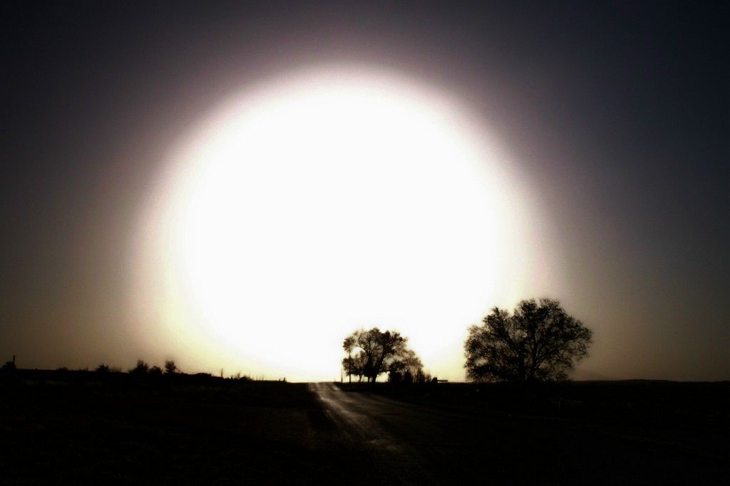 sunset behind dust