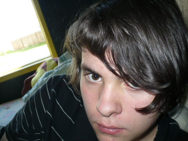 THIS, is me.
Well, at an odd angle, lol, See that yellow thing in the background, with the brown stripes? That is my huge Pikachu thingie! I'll end up
